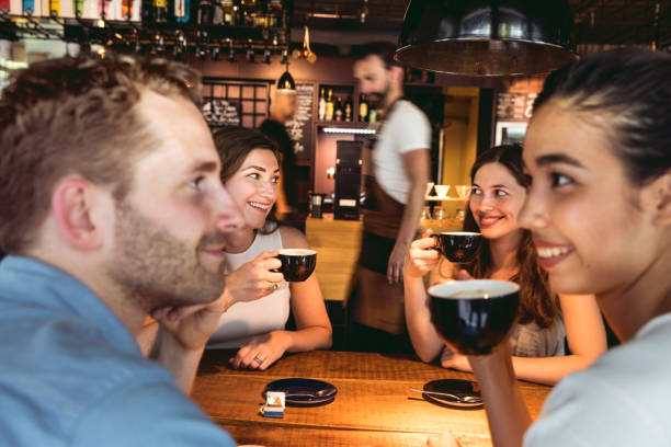 istock Friends celebrating a party in a cafe 806145086
