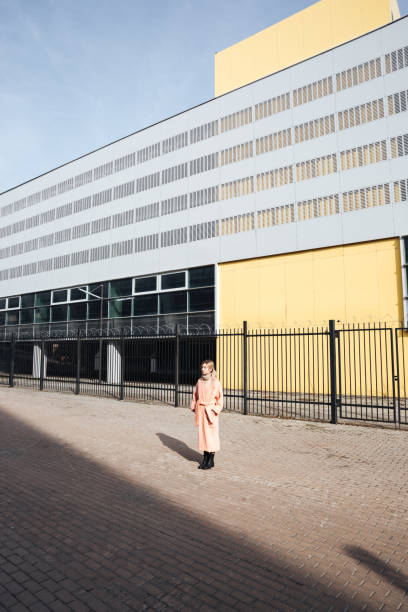 istock Serious young blonde lady walking outdoors. Looking aside. 806145124