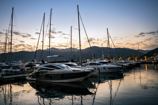 istock Luxury motor yachts on sunset 806149510