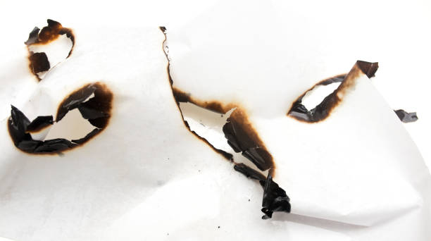istock Trail of burnt paper on white background 806149846