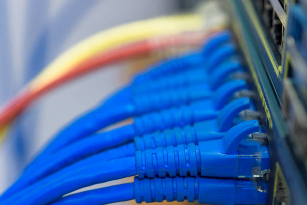 Network switch connected with RJ45 UTP cables stock photo