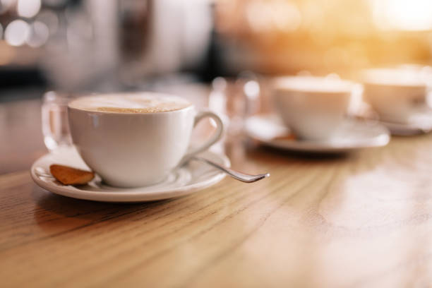 istock Cup of fresh coffee on cafe table 806165432