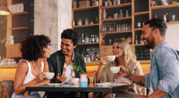 istock Young people sitting at a coffee shop 806165520