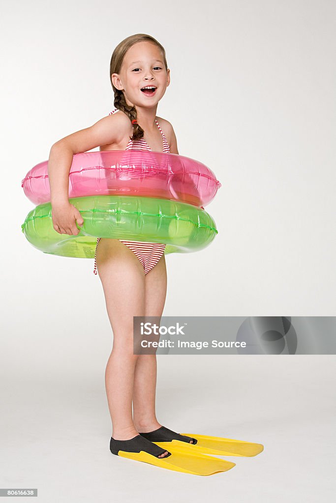 A girl wearing colchonetas inflables anillos - Foto de stock de Flotador - Inflable libre de derechos
