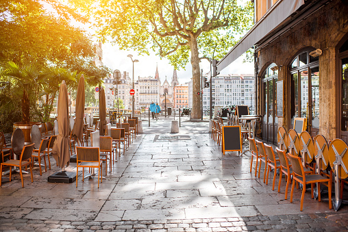 Street view with cafes near the river in the old town in Lyon city