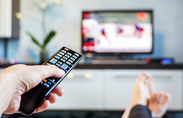 istock Men with the remote control, front of the television. 806186516