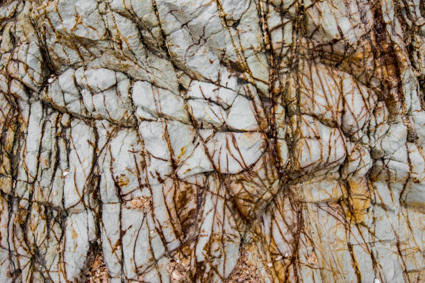 istock Detailed textures and patterns of a cliff by the beach in Thailand 806192212