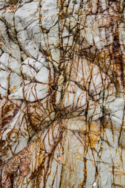 istock Detailed textures and patterns of a cliff by the beach in Thailand 806194306