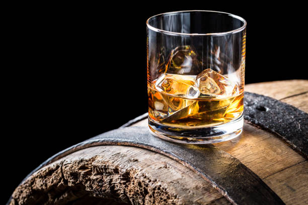 istock Old and tasty brendy with ice on oak barrel 806202546