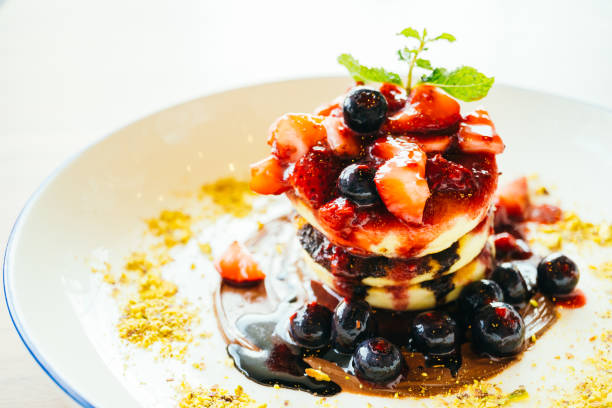 istock Pancakes with mixed berry fruit in white plate 806214698