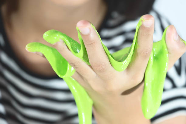 istock Kid Playing Hand Made Toy Called Slime, Selective focus on Slime 806236356