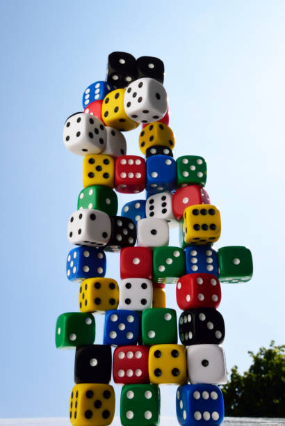 istock Dice; different colours; piled on top of each other against blue sky. 806239332
