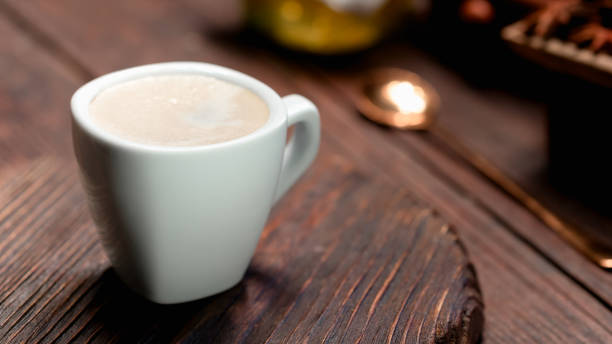 istock White coffee cup on brown wood 806241702