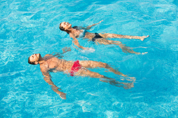 istock Affectionate couple in swimming pool 806242212
