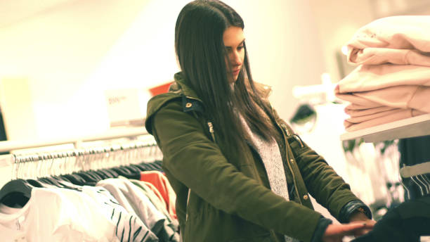 istock Woman in shop looking for clothes 806246986