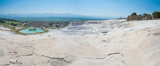 Paranorama wide angle of Turquoise water travertine pool terrace at pamukkale