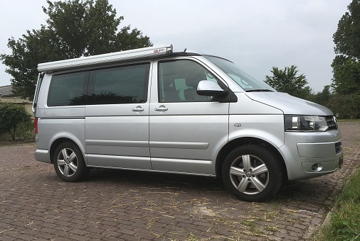 Almere, Flevoland, The Netherlands - June 30, 2017: Gray Volkswagen T6 California parked on a public parking lot in the city of Almere. Nobody in the vehicle.