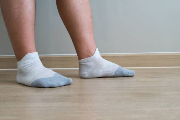 istock Closeup with fat man feet 806254358