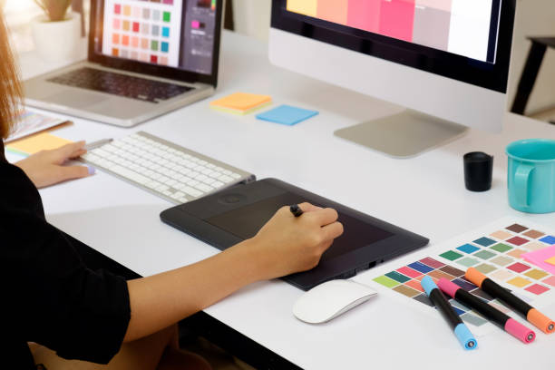istock Artist drawing something on graphic tablet at the office. 806258386