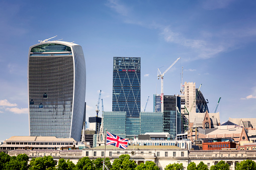 Union Jack flag and iconic London landmarks in the background