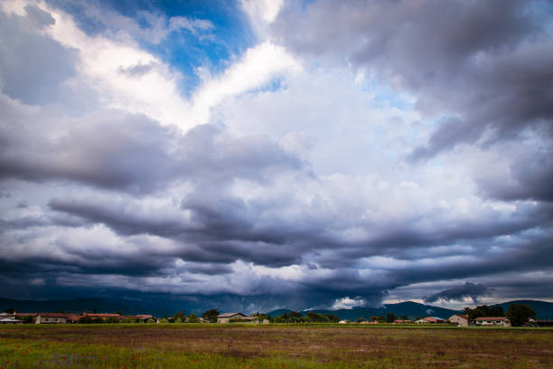 Sunset behind the clouds before a spring showerSunset behind the clouds before a spring showerSunset behind the clouds before a spring showerSunset behind the clouds before a spring shower