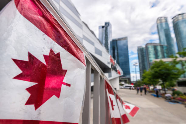 istock Canada plastic flag with blurred urban background in Toronto 806278508