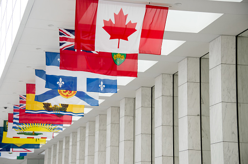 Picture of the canadian Flag along with the flags of the 10 Canadian Provinces and the 3 Canadian Territories in Toronto, Canada