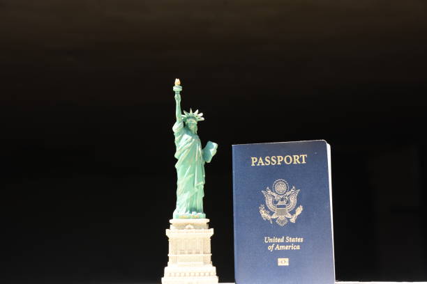 istock Statue of Liberty with an American passport 806289900