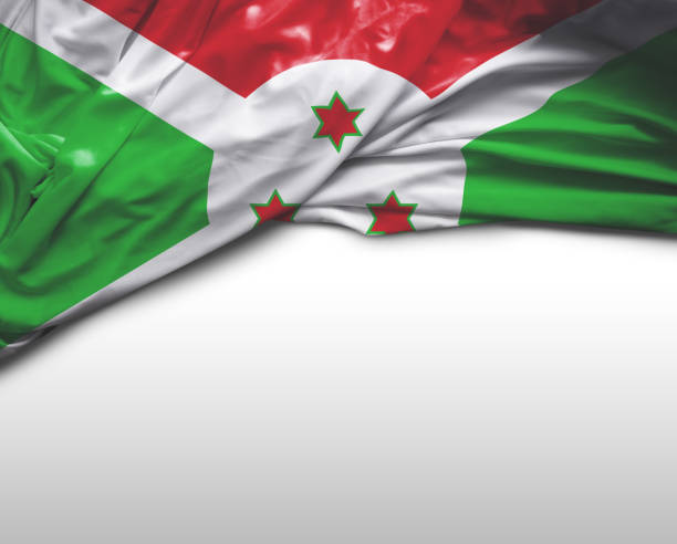 Grunge map of Burundi with its flag printed within its border on an old paper.