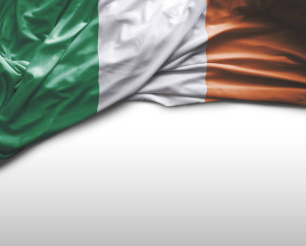 bandiera irlandese sventolante - irish flag foto e immagini stock