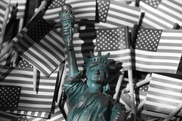 Statue of Liberty against the backdrop of US flags