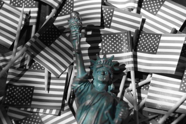 istock Statue of Liberty against the backdrop of US flags 806295834