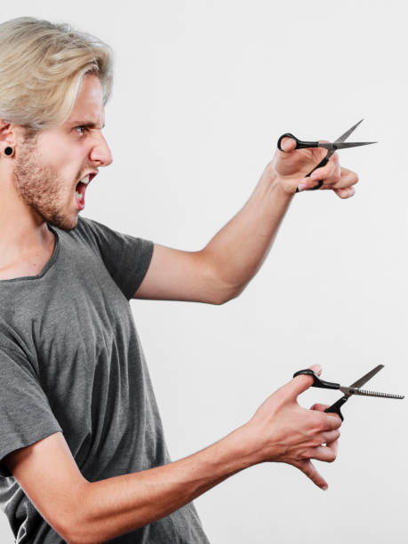 istock Man with scissors for haircutting 806301946