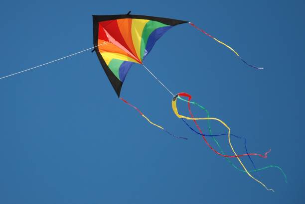 istock Colourful kite against blue sky 806305078