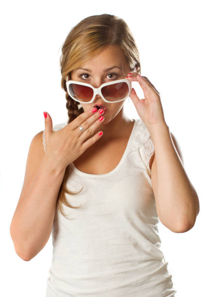 teenage girl with sunglasses surprised on white stock photo