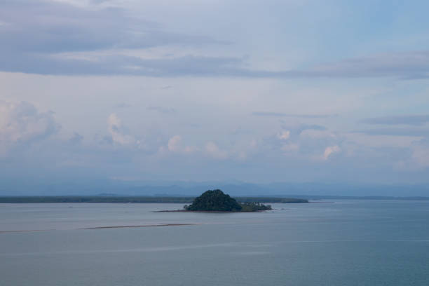 istock Simple island on sea and blue sky 806307376