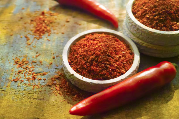 istock Red hot chili Cayenne pepper fresh and dried powdered spice, ready to use. 806310322