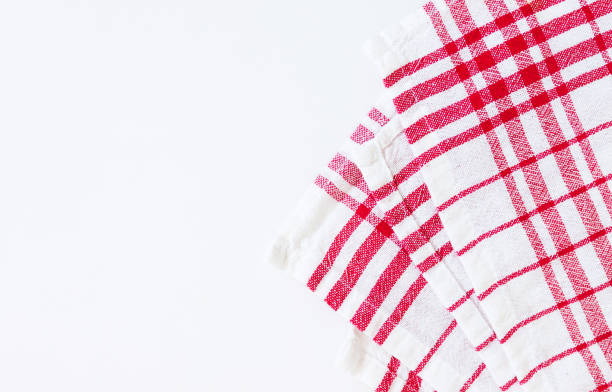 istock Red cloth, a kitchen towel with a checkered pattern, on a white background isolated 806311448