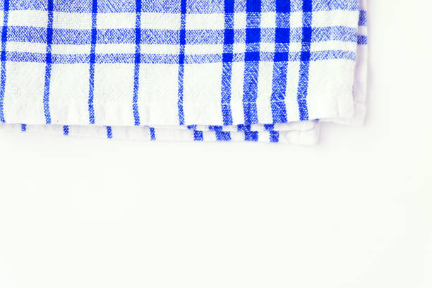 istock Blue cloth, a kitchen towel with a checkered pattern, on a white background isolated 806312978