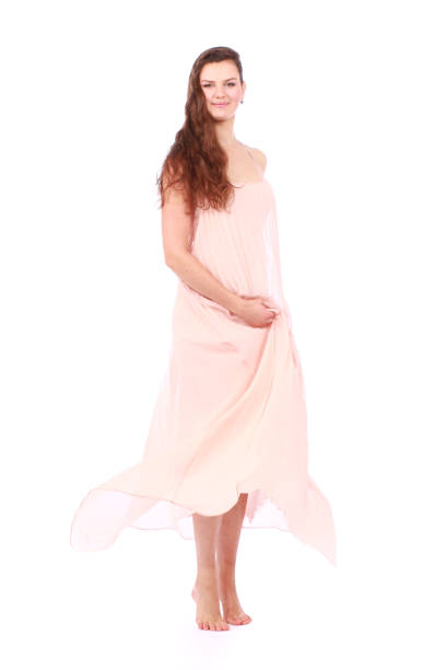 graceful girl in flying light pink dress stock photo