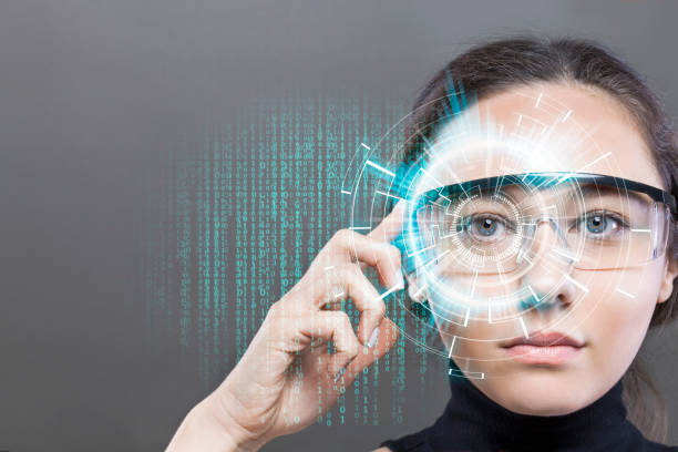 Futuristic smart glasses Young woman loking at virtual graphics in futuristic background head mounted display stock pictures, royalty-free photos & images