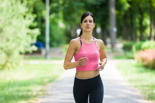 istock woman run in a park 806318092