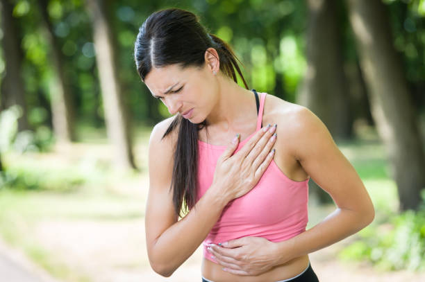 fitness woman heartache in a park in summer fitness woman heartache in a park in summer former yugoslavia stock pictures, royalty-free photos & images