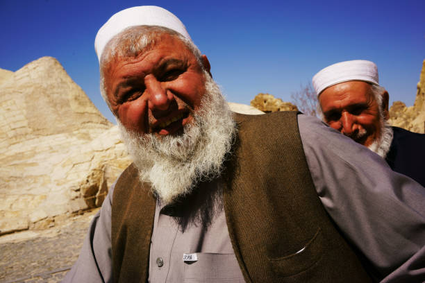Goreme, Turkey-April 2, 2017:A traditional dressed Turkish Muslim is enjoying the sunshine