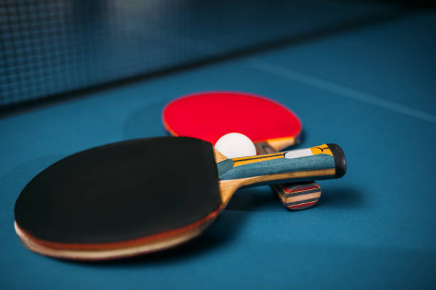 istock Tennis rackets and ball on the table, game concept 806339116