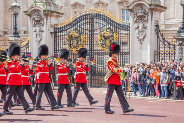 London, England - August 11 2012: A soldier of the Grenadier guards posted outside Buckingham Palace. The Palace is the official London residence of the British Monarch and the Grenadiers are the most senior regiment of the guards division.