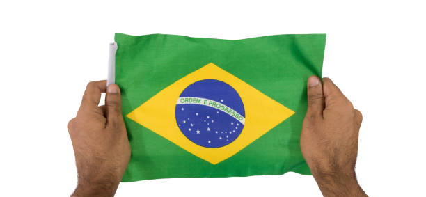 istock Holding a brazilian flag isolated on white background 806354974