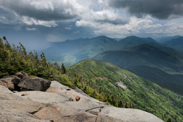 A dark brooding sky of thunderclouds over the Dix Mountain range in the Adirondack Mountains of New York State