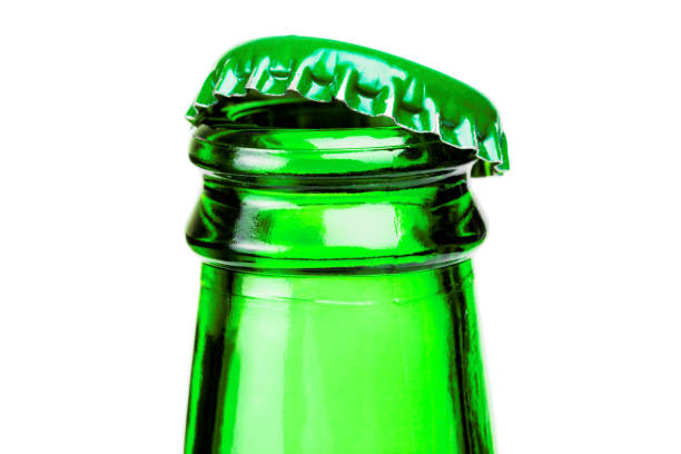 istock Bottleneck of green beer bottle over white background. Filtered image: cross processed vintage effect. 806360606