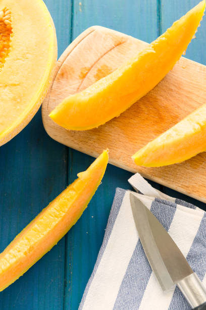 istock cantaloupe melon on the wooden table 806377872